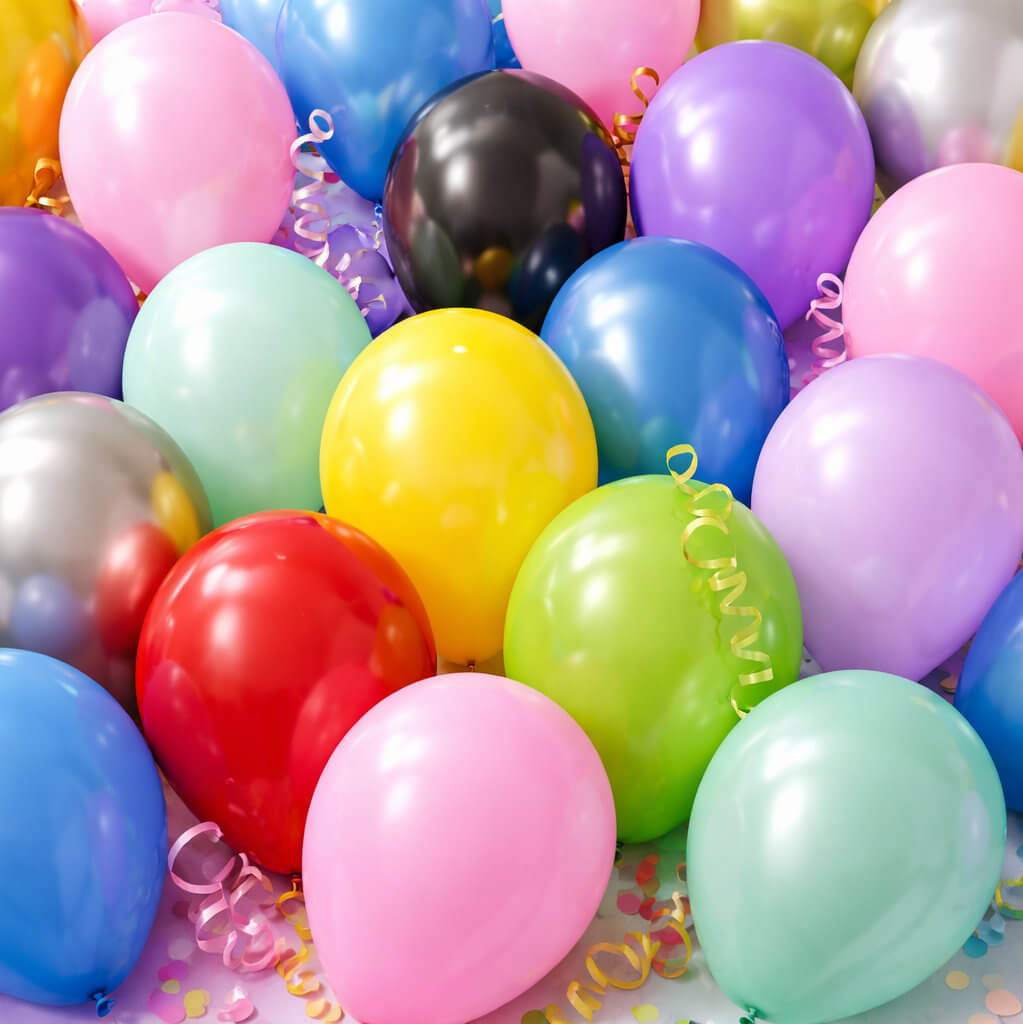 Range of 30cm latex party balloons in multiple colours including pastel and metallic for party decorations