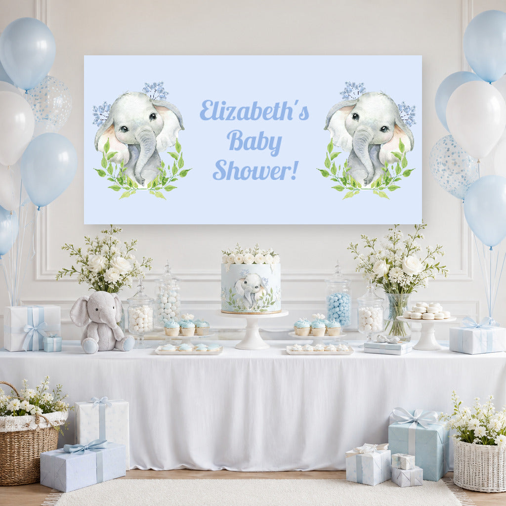 Blue leaves elephant baby shower dessert table with Elizabeth's personalised banner, cake, blue balloons and matching party decorations.