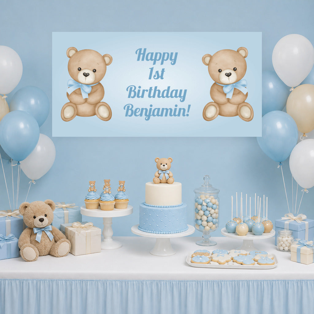 Blue teddy bear first birthday dessert table with Benjamin's personalised banner, cake, blue balloons and matching decorations.