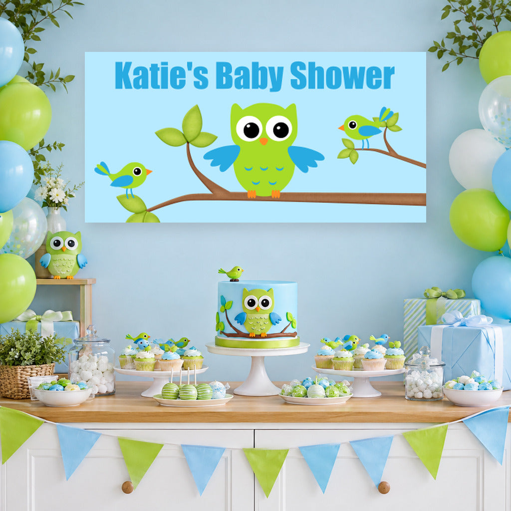 Boys birds and owl baby shower dessert table with Katie's personalised banner, owl cake, blue and green balloons and matching party decorations.