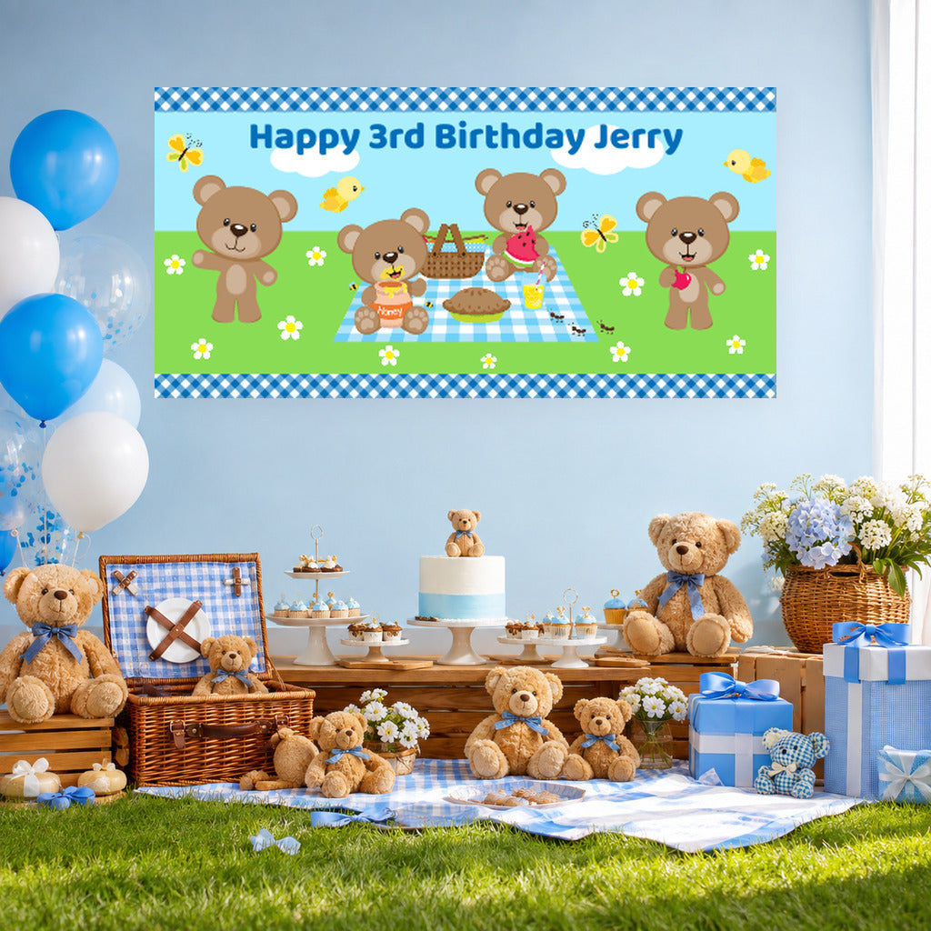 Boys teddy bears picnic birthday dessert table with Jerry's personalised banner, teddy bear cake, blue balloons and matching decorations.