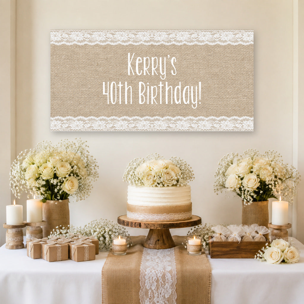 Burlap and lace birthday dessert table with Kerry's personalised 40th birthday banner, cream cake, white flowers, candles and rustic decorations.