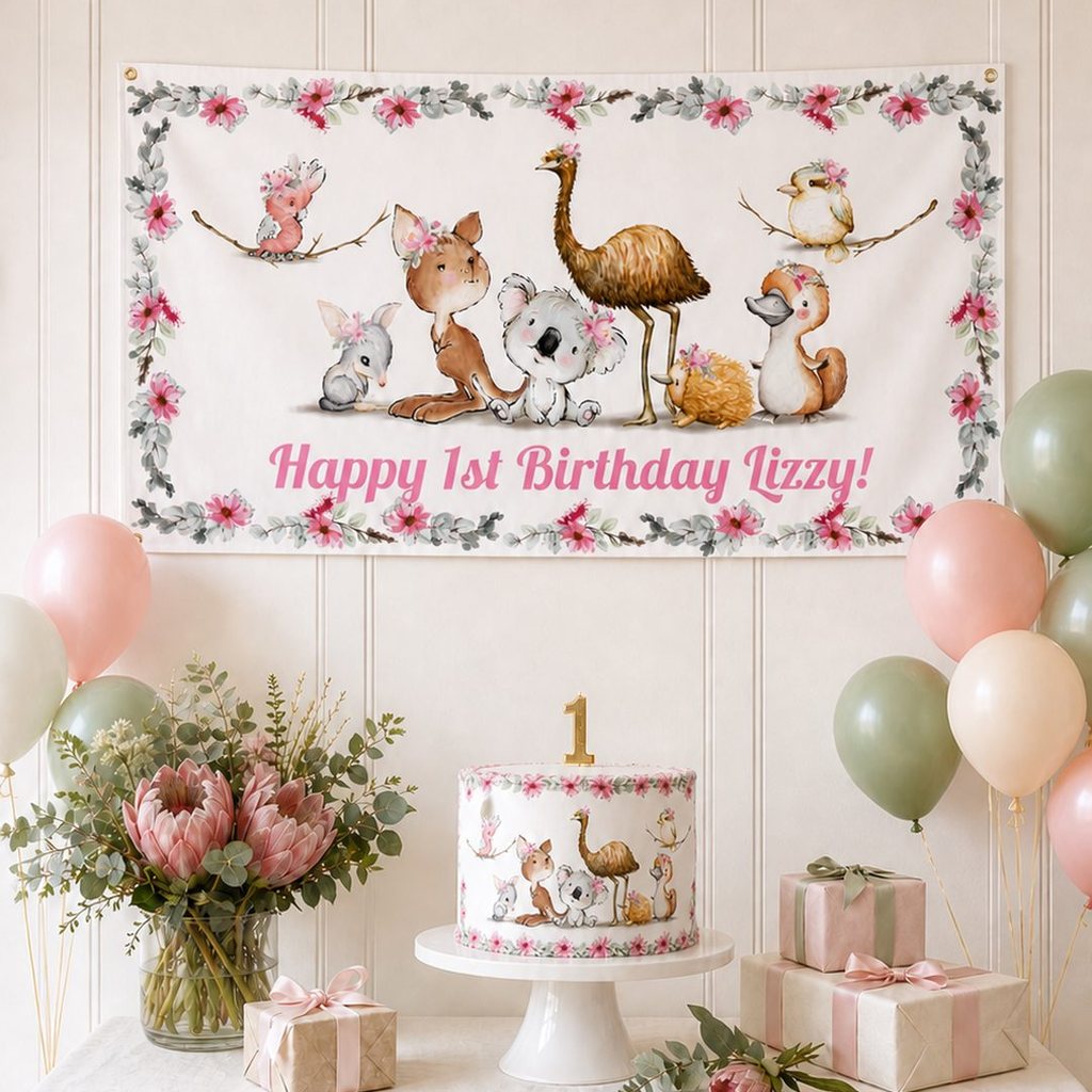 Personalised floral Australian animals first birthday decorations with Lizzy's custom banner and cake