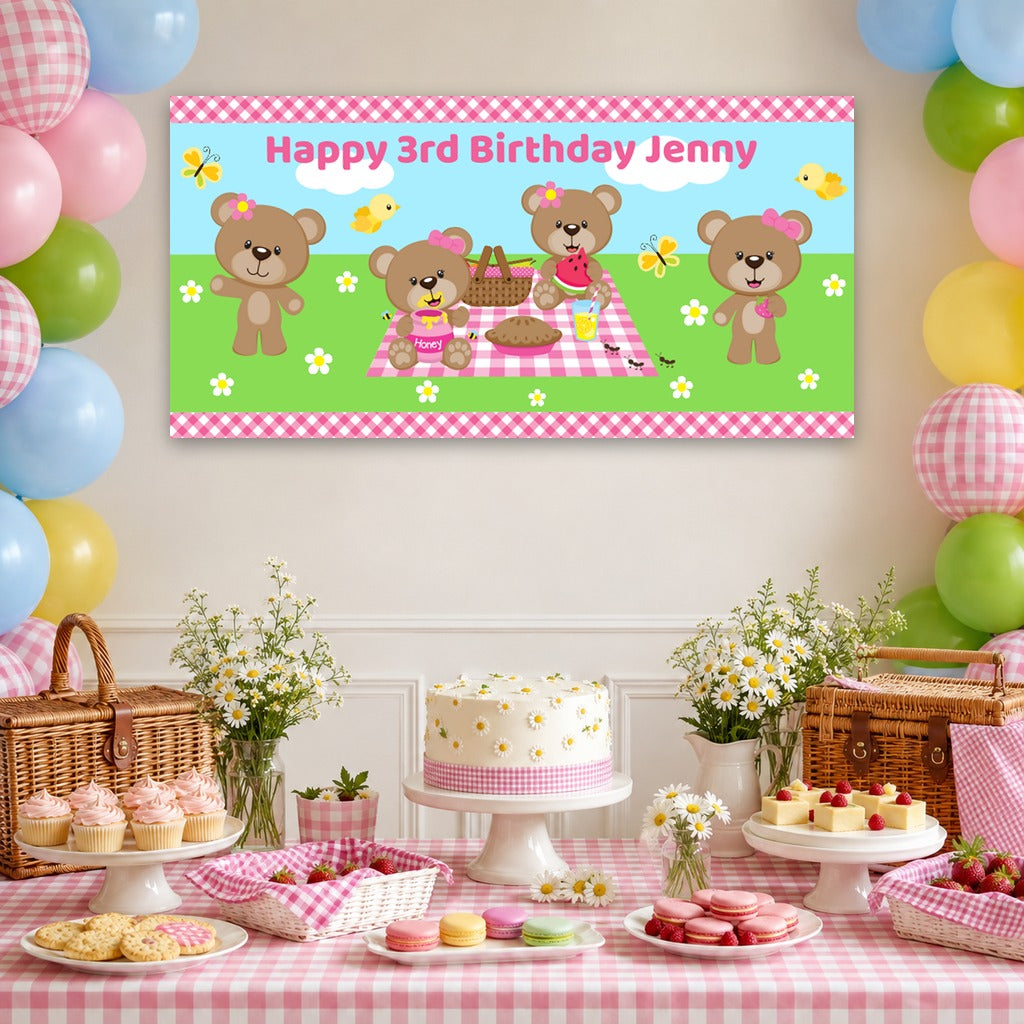 Girls teddy bears picnic dessert table with Jenny's personalised pink gingham banner, teddy bear cake, balloons, daisies and picnic decorations.