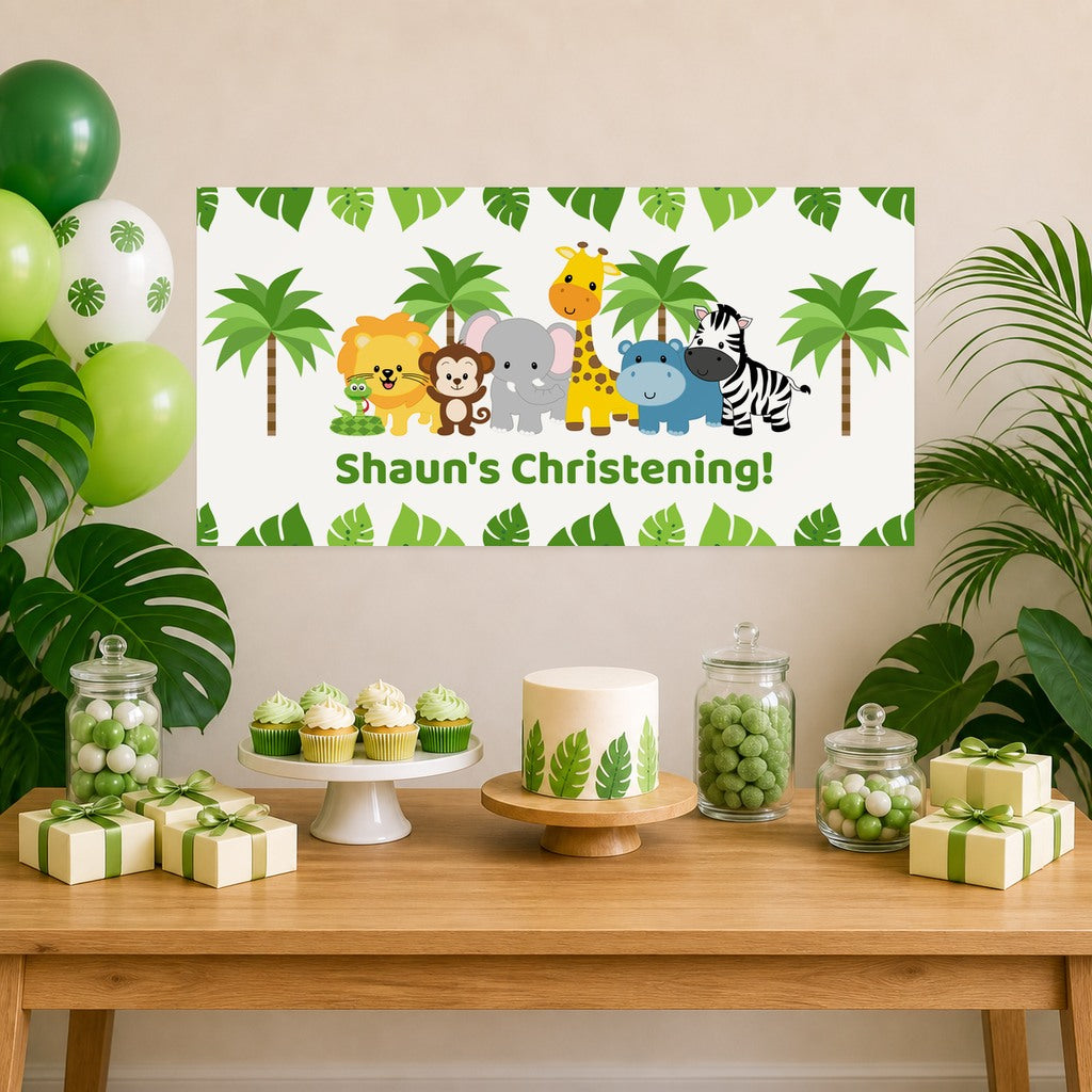 Jungle Animals christening decorations featuring Shaun's personalised banner, a coordinated cake, cupcakes and gifts.
