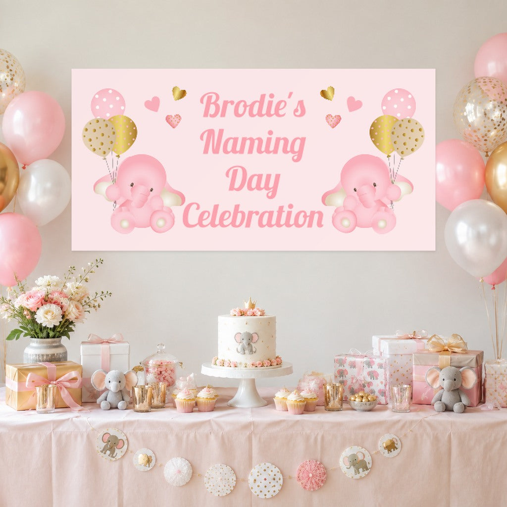 Pink and gold baby elephant naming day dessert table with Brodie's original personalised banner, cake, balloons and matching gifts.