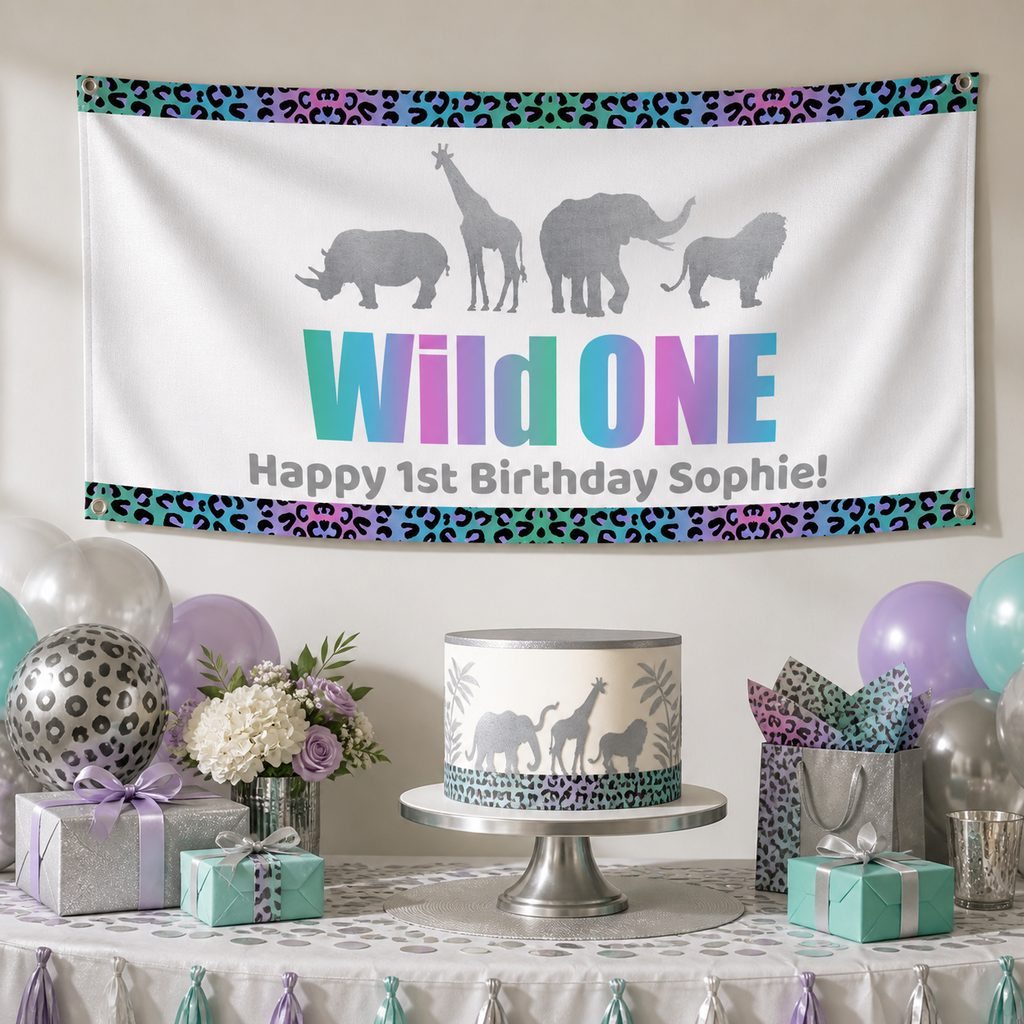 Rainbow and silver Wild One first birthday setup with Sophie's personalised safari banner and matching cake
