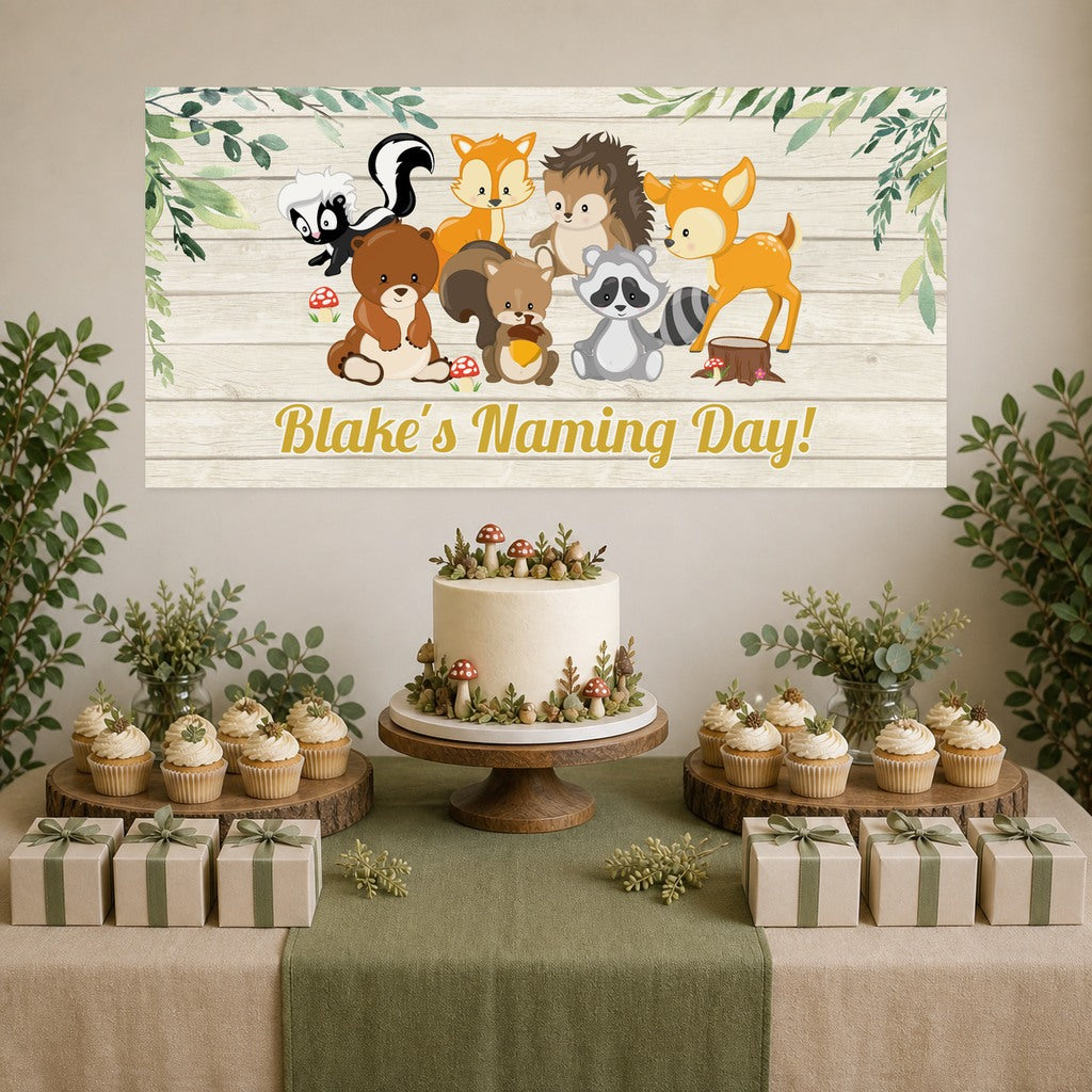 Woodland Animals naming day decorations featuring Blake's personalised banner, a coordinated cake, cupcakes and gifts.