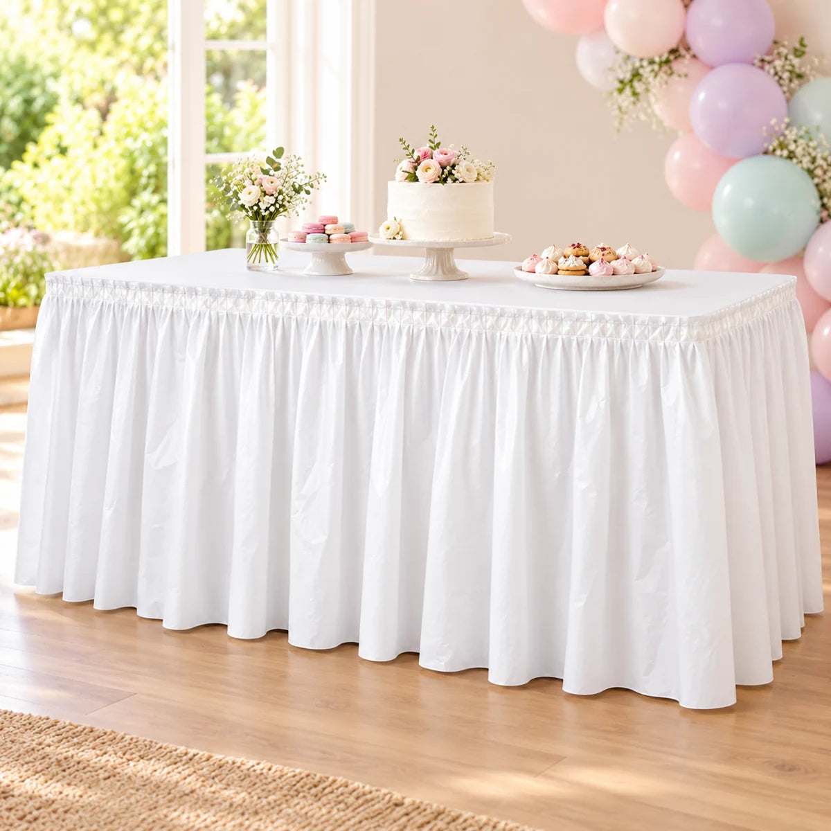 Bright White plastic table skirt styled on a pastel party cake table; illustrative styling, props and tabletop cover excluded.