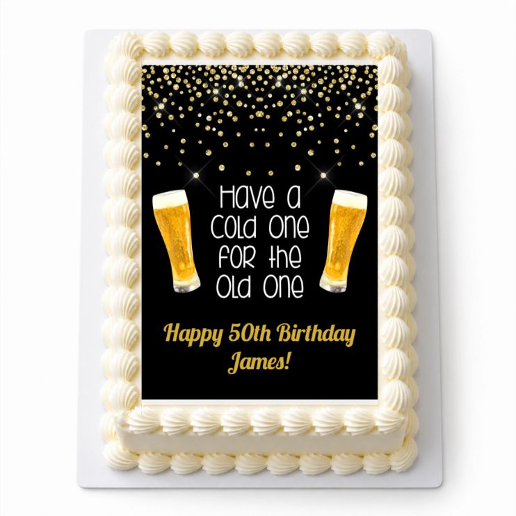Cold One for the Old One personalised A4 icing sheet on a cream cake with Happy 50th Birthday James wording. Cake not included.
