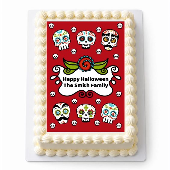 Personalised Day of the Dead A4 rectangle icing sheet with colourful sugar skulls, fitted to a white cake.