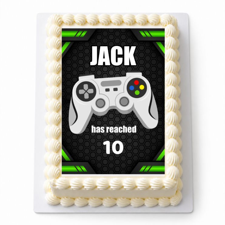 Personalised Gaming A4 icing sheet shown on a cream cake with Jack and age 10 example wording. Cake not included.