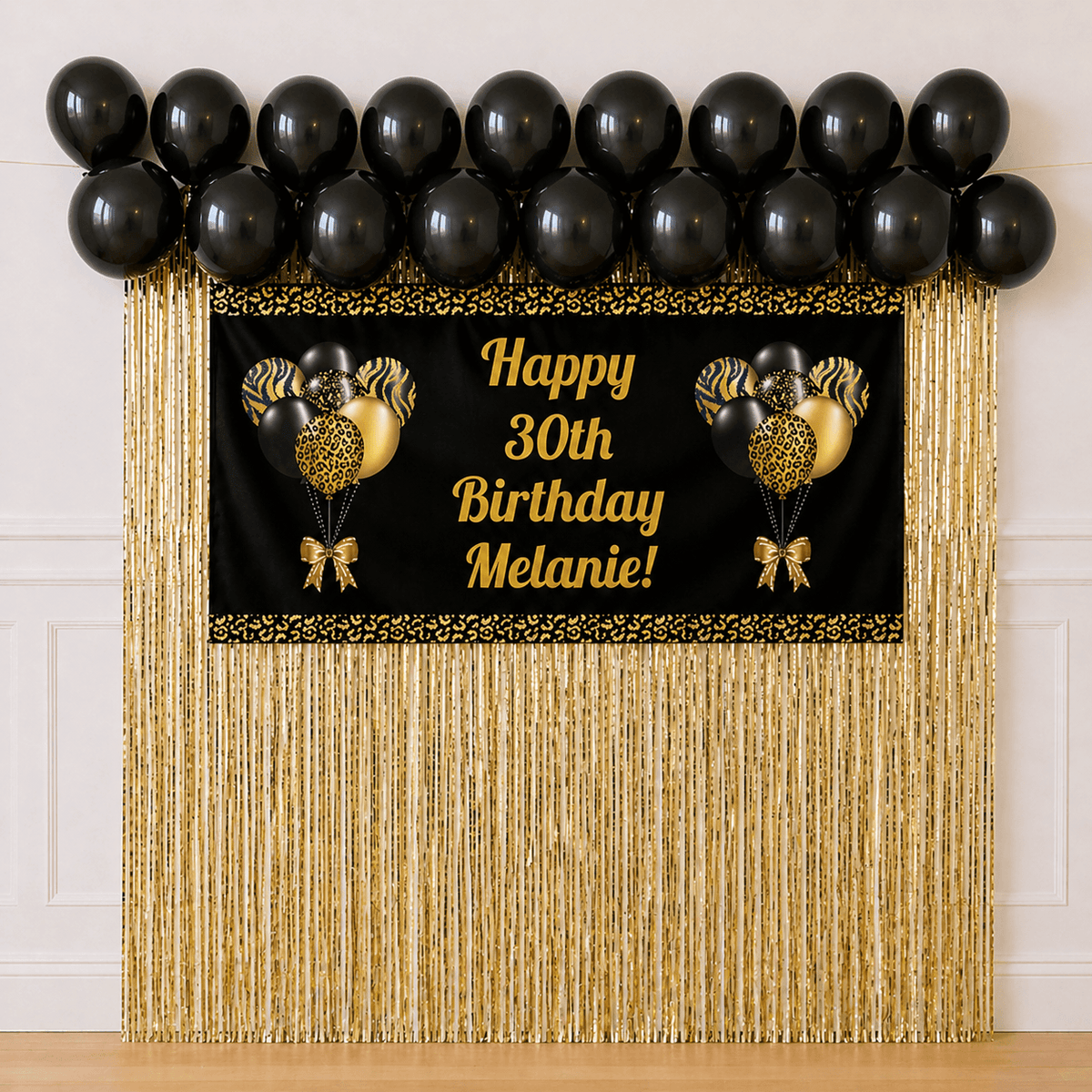 Black and gold party package with custom XL banner, black balloons and gold foil curtain backdrop