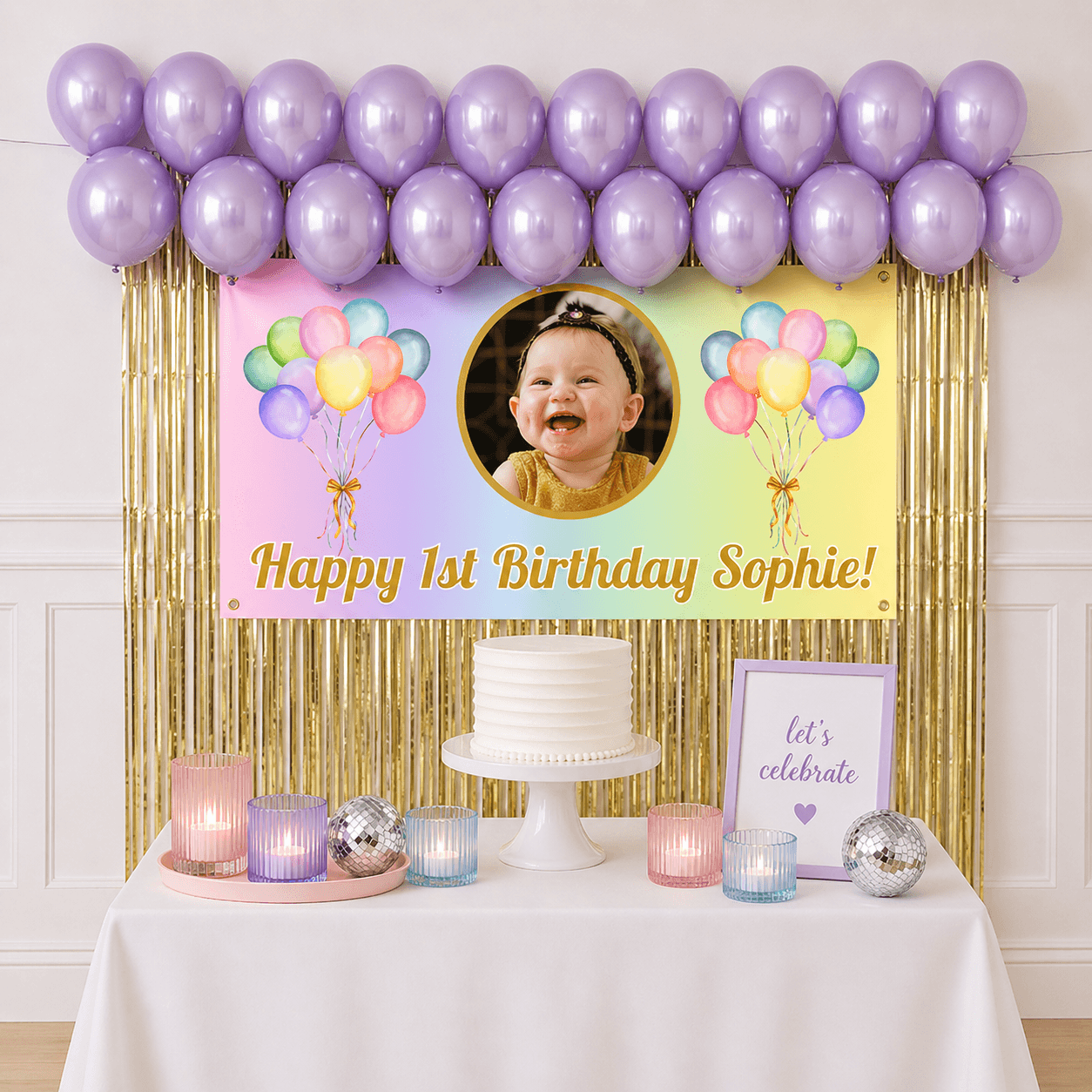 Personalised pastel rainbow celebration party package with photo banner, pastel purple balloons and gold foil fringe curtains displayed as a completed party setup