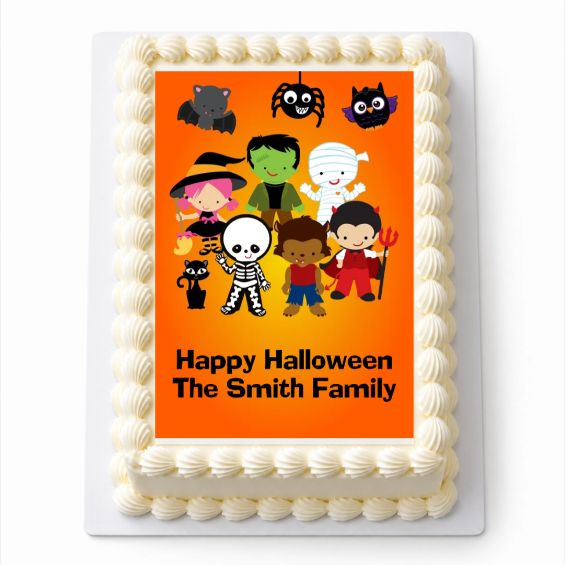 Personalised Little Halloween Monsters A4 rectangle icing sheet with colourful Halloween characters, fitted to a white cake.
