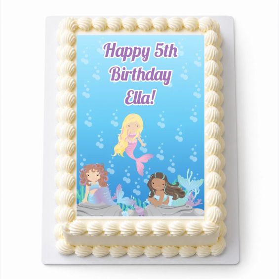 Personalised Mermaids A4 rectangle icing sheet with mermaids under the sea, fitted to a white cake.