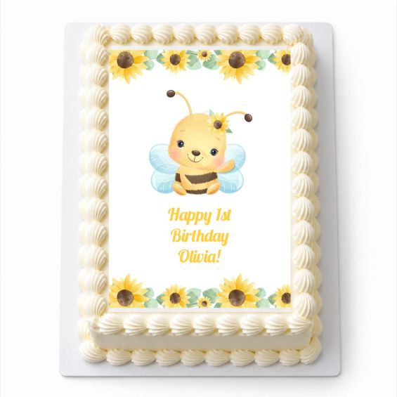 Personalised Sunflower and Honey Bee A4 icing sheet fitted inside the piping of a white rectangular cake