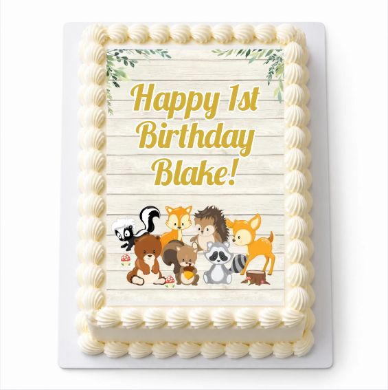 Woodland Animals A4 icing sheet fitted to a white cake with Happy 1st Birthday Blake wording